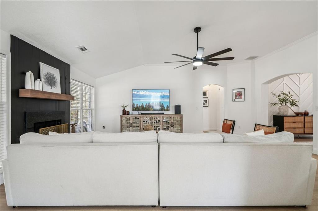 198 Celestial Run Winder, GA 30680 - Photo 6 of 30 a living room with fireplace furniture and a flat screen tv