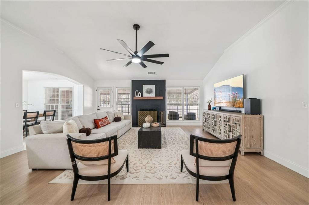 198 Celestial Run Winder, GA 30680 - Photo 8 of 30 a living room with fireplace furniture and a wooden floor