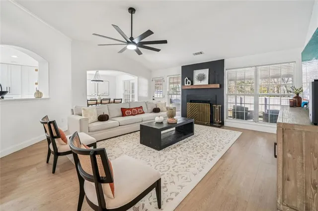 a living room with furniture and a fireplace