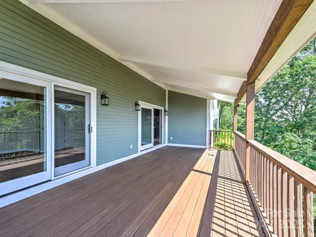 a view of balcony with wooden floor