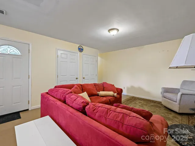 a living room with furniture and a couch