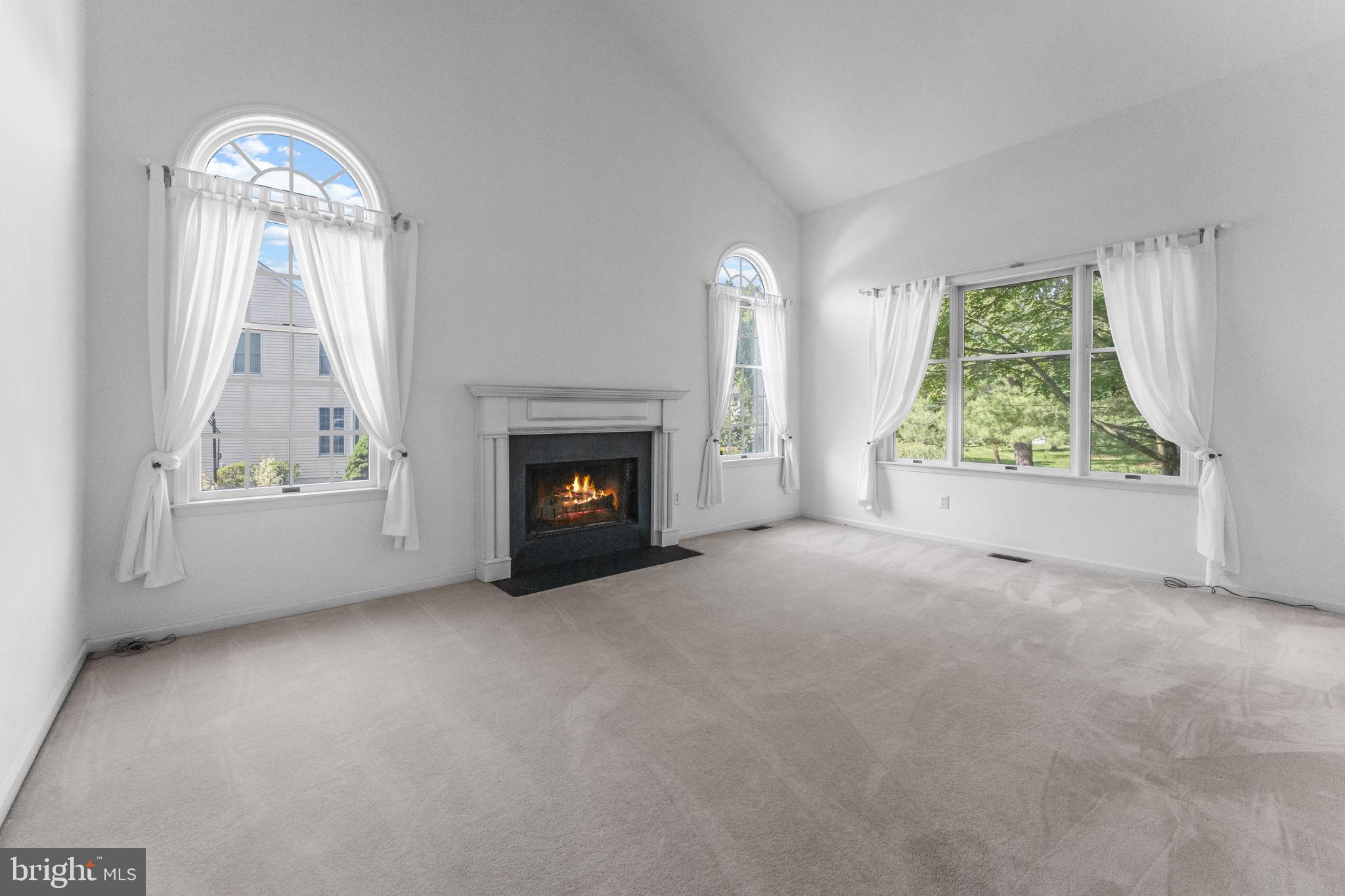 2 Seminole Road Skillman, NJ 08558 - Photo 19 of 60 an empty room with windows fire place and a fireplace