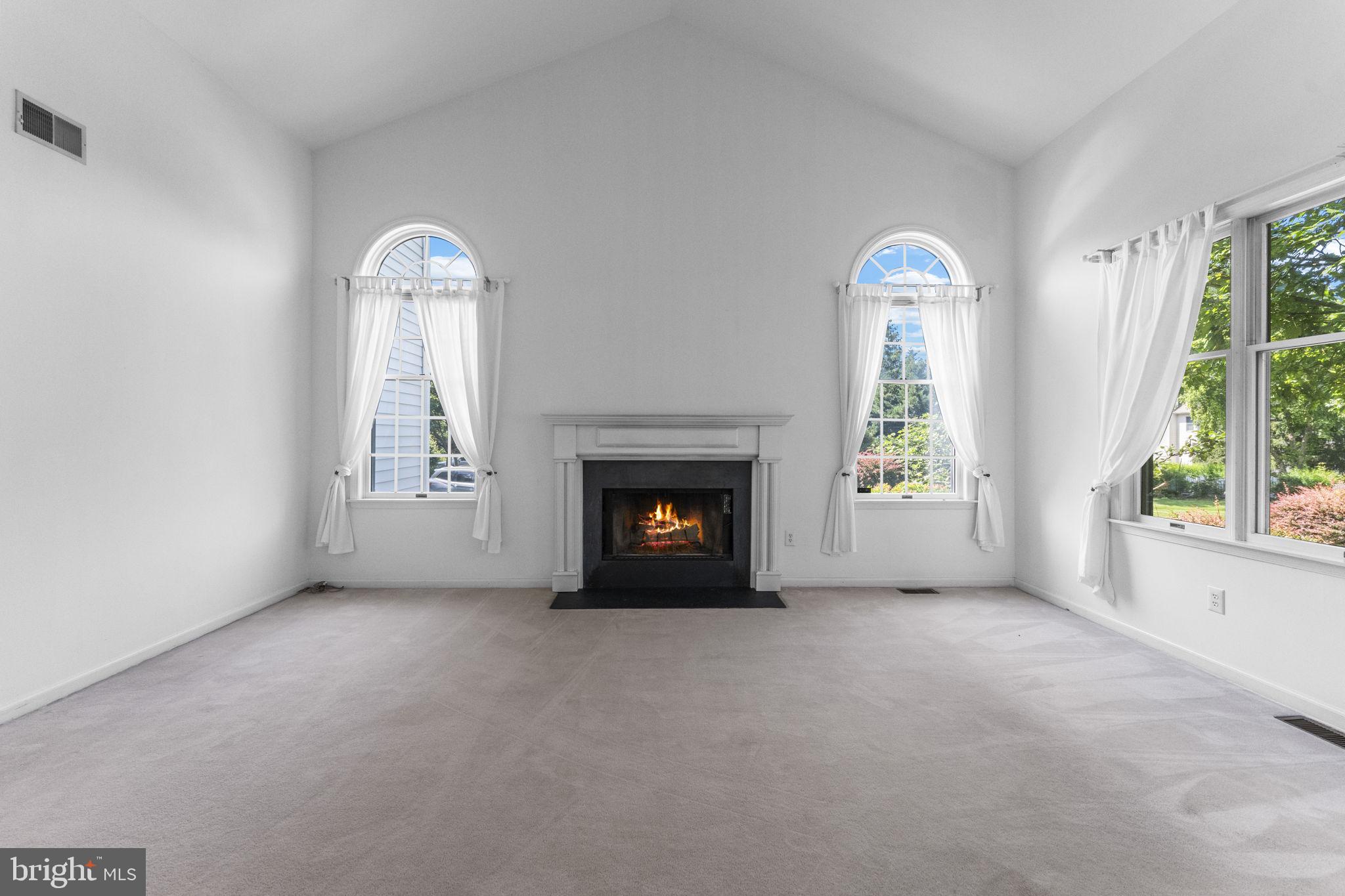 2 Seminole Road Skillman, NJ 08558 - Photo 22 of 60 an empty room with windows and fireplace