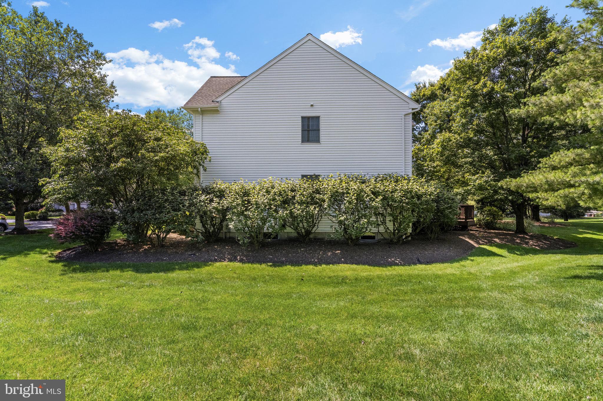 2 Seminole Road Skillman, NJ 08558 - Photo 47 of 60 a view of a backyard with plants and large trees