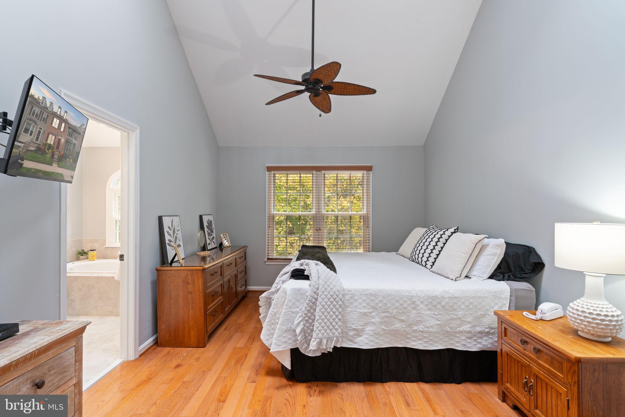 8852 Eagle Rock Lane Springfield, VA 22153 - Photo 18 of 61 a bedroom with a bed and window