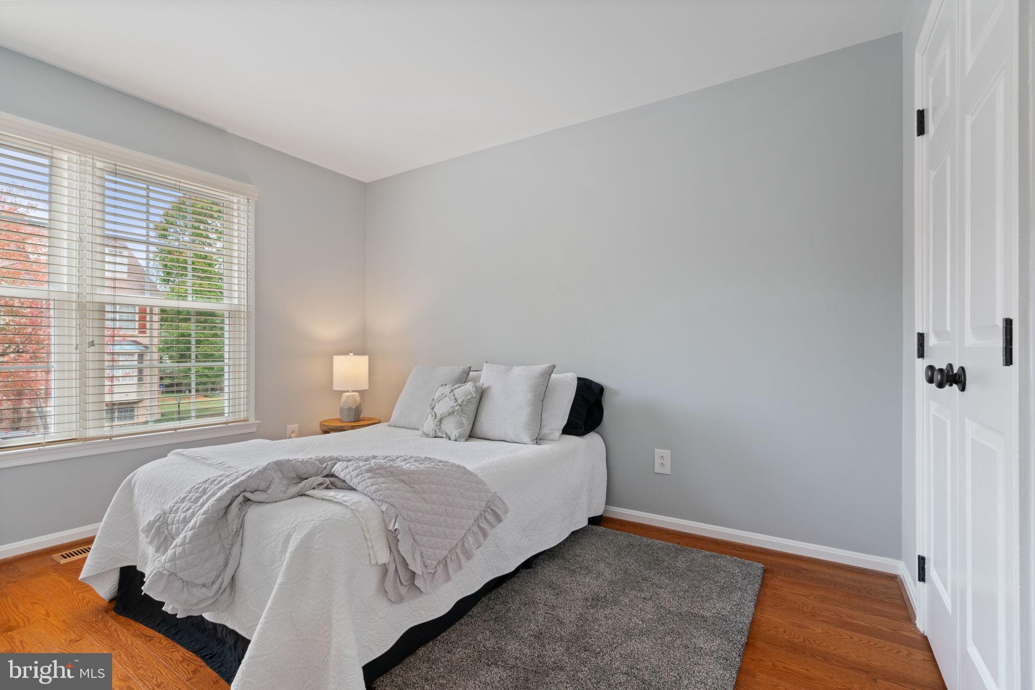 8852 Eagle Rock Lane Springfield, VA 22153 - Photo 25 of 61 a bedroom with a bed and a window with outer view