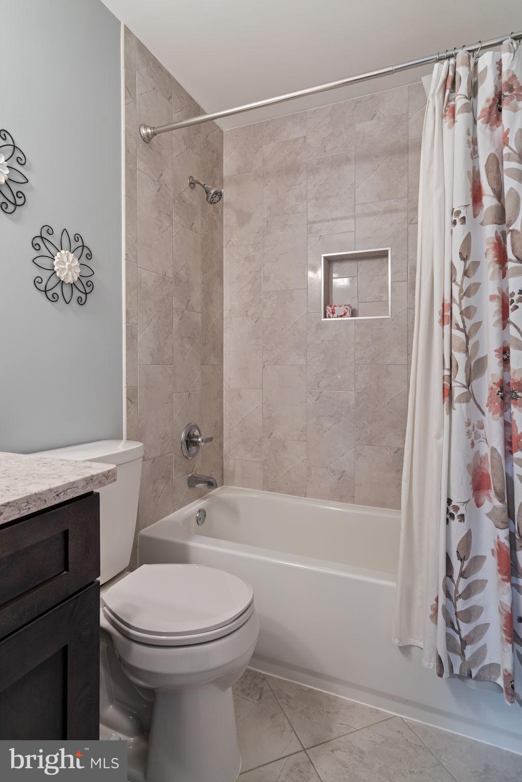 8852 Eagle Rock Lane Springfield, VA 22153 - Photo 29 of 61 a bathroom with a toilet and a shower