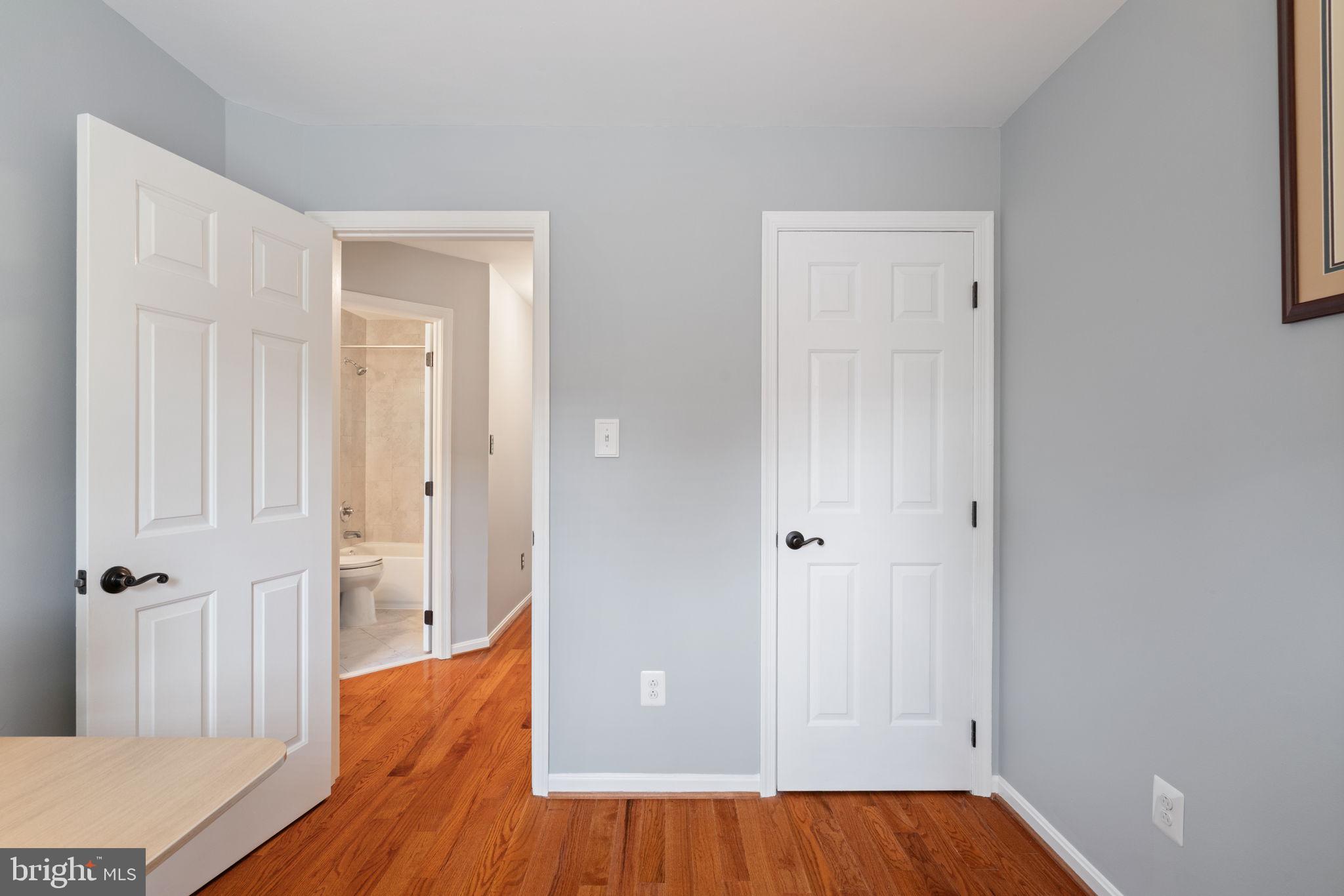 8852 Eagle Rock Lane Springfield, VA 22153 - Photo 31 of 61 a view of a hallway with wooden floor and closet area