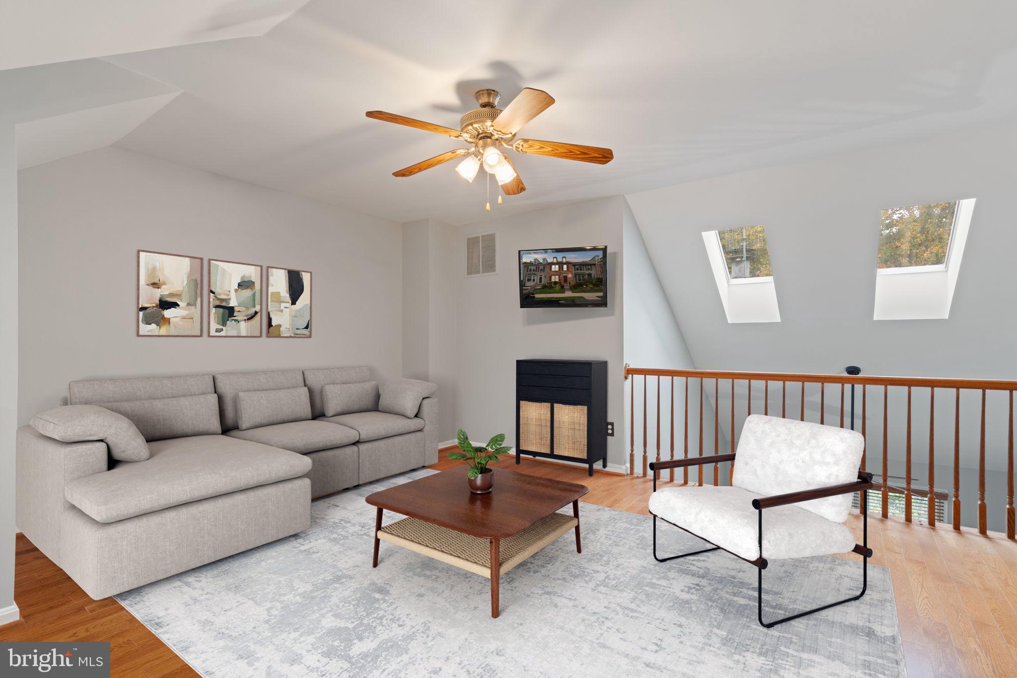 8852 Eagle Rock Lane Springfield, VA 22153 - Photo 35 of 61 a living room with furniture a rug and a window