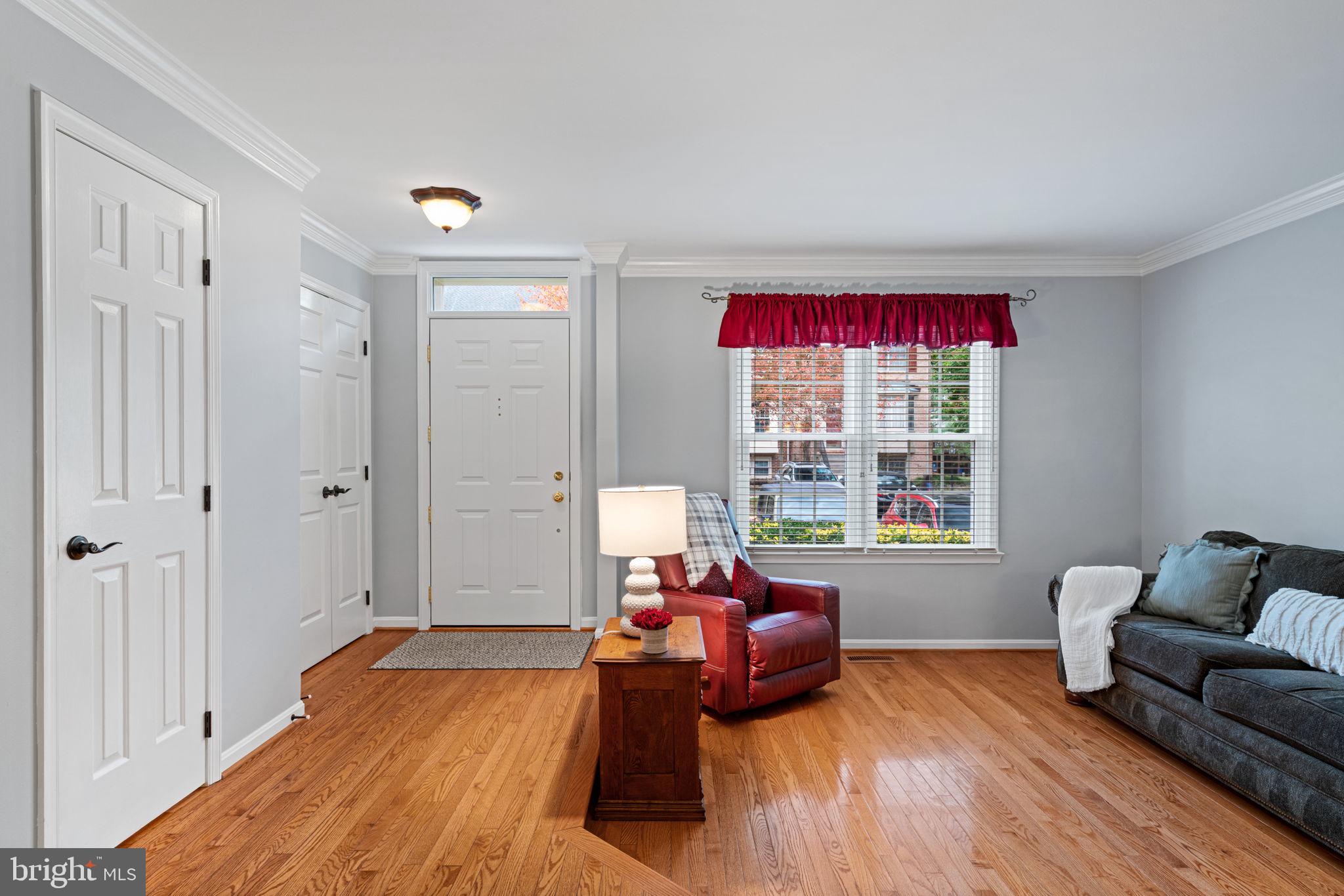 8852 Eagle Rock Lane Springfield, VA 22153 - Photo 4 of 61 a spacious bedroom with a bed and wooden floor