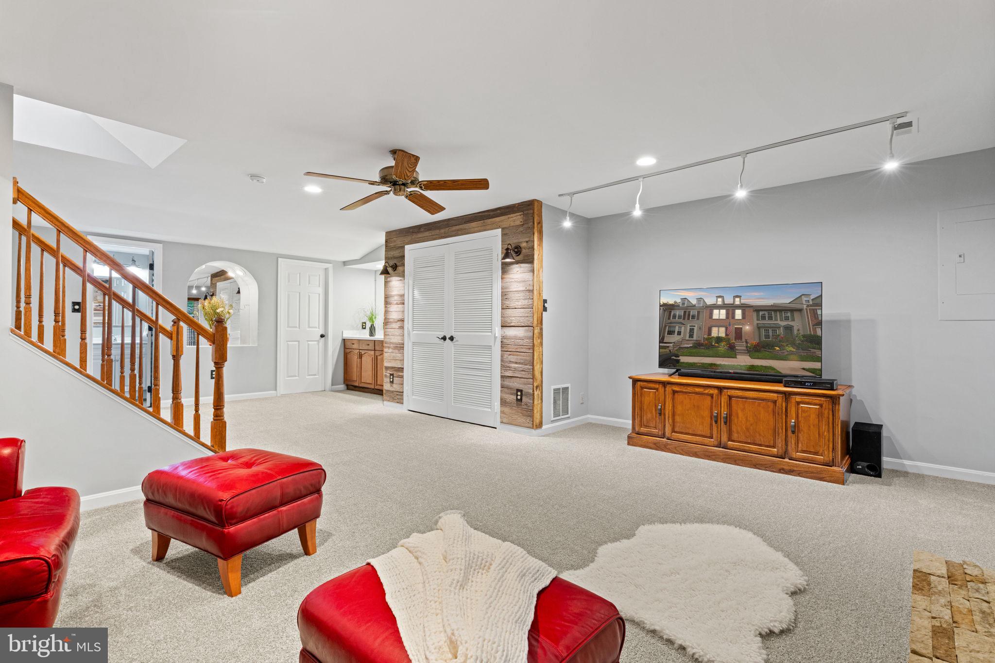 8852 Eagle Rock Lane Springfield, VA 22153 - Photo 43 of 61 a living room with furniture and a rug