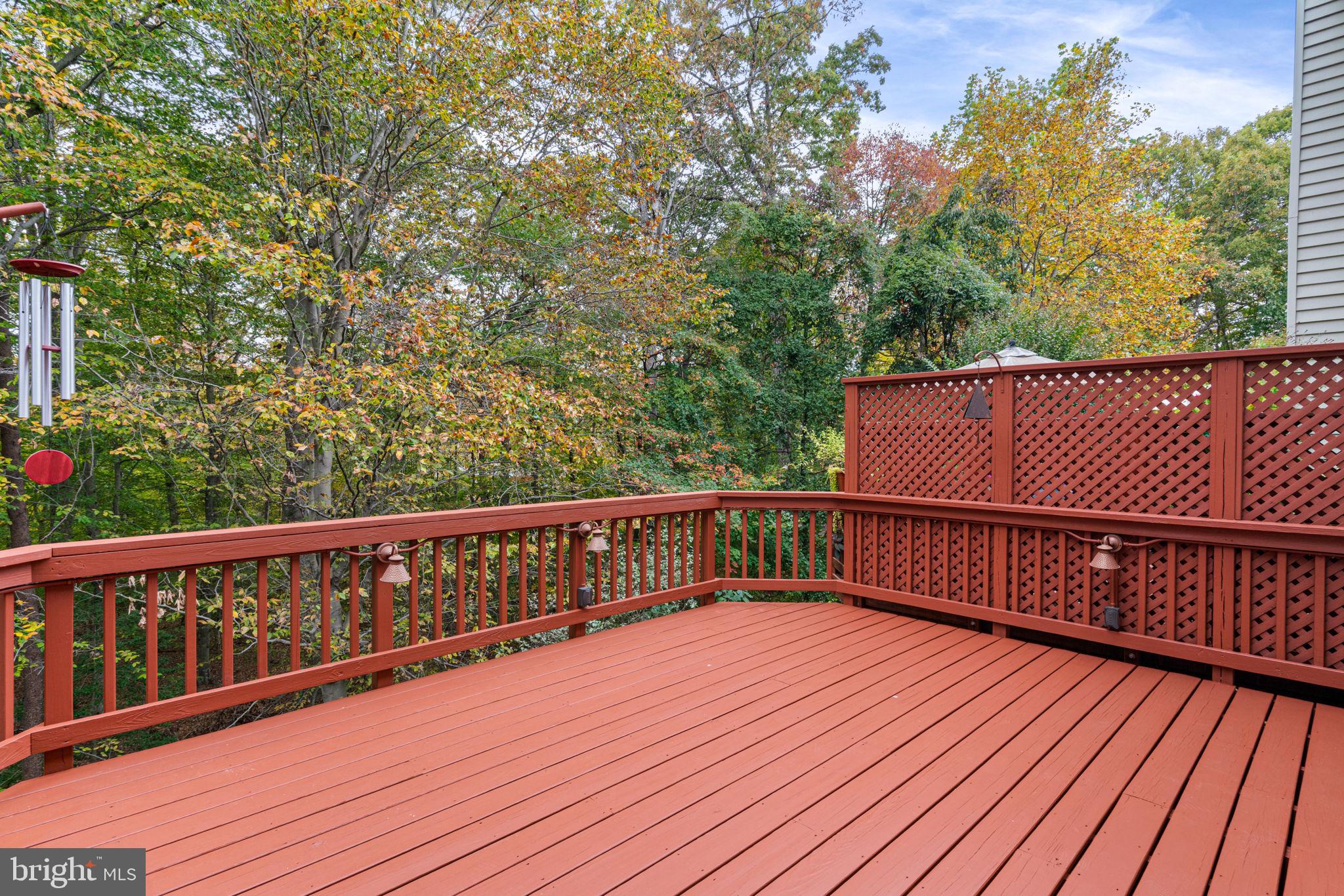 8852 Eagle Rock Lane Springfield, VA 22153 - Photo 53 of 61 a balcony with wooden floor and trees