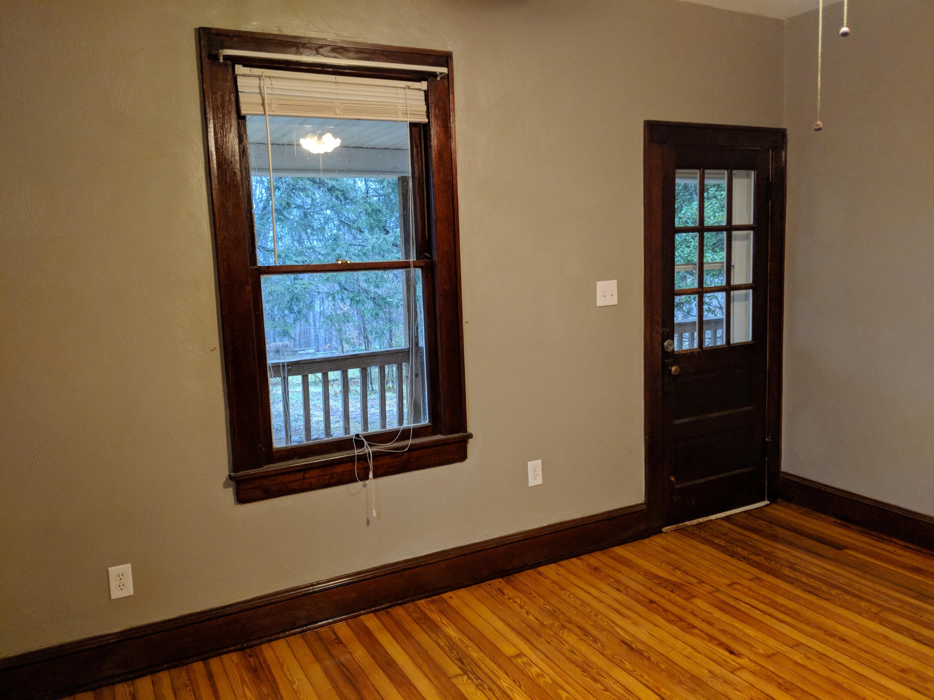 2902 Riverview Road Roanoke, VA 24014 - Photo 11 of 15 a view of an empty room with wooden floor and a window