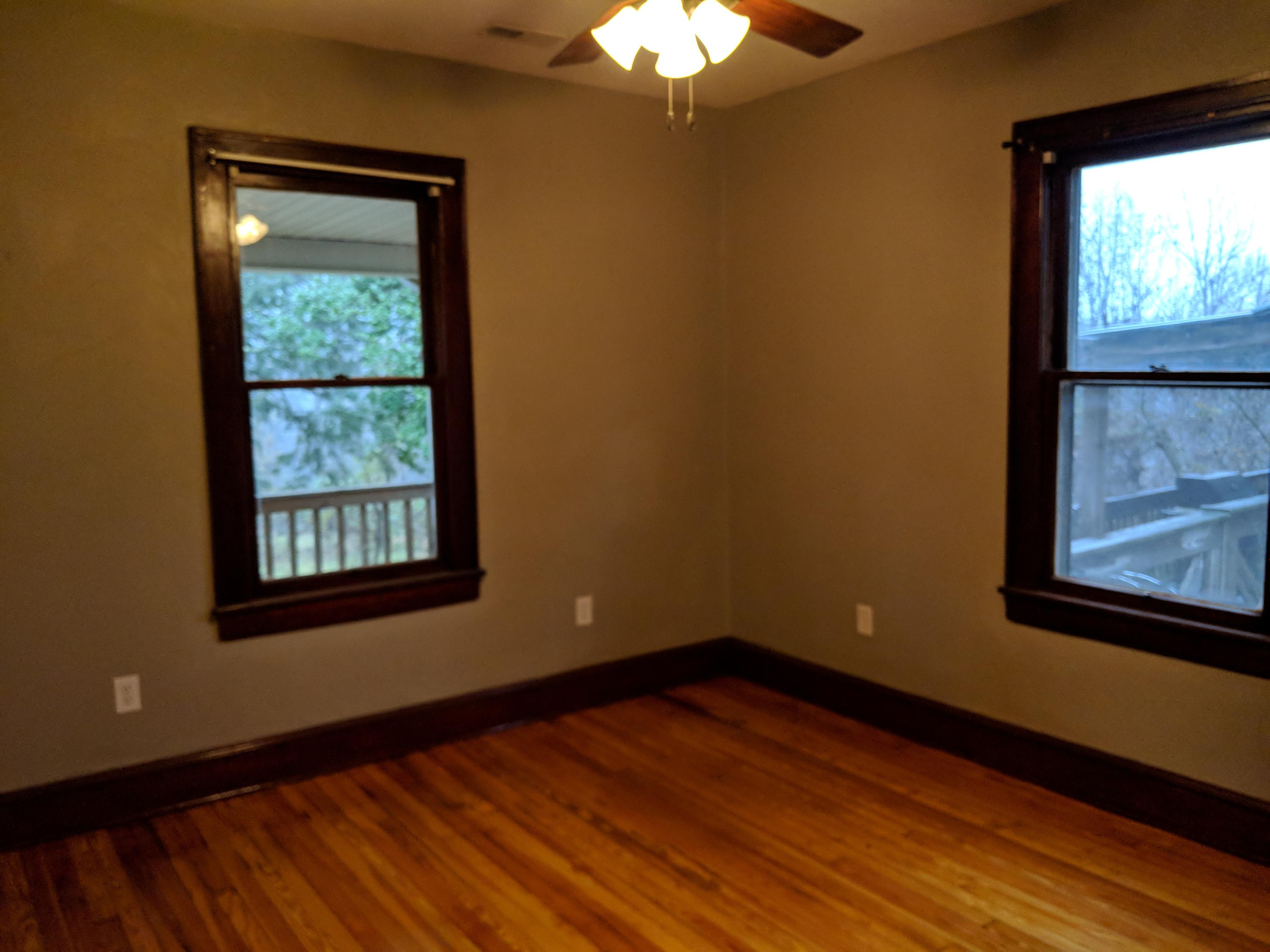 2902 Riverview Road Roanoke, VA 24014 - Photo 12 of 15 a view of an empty room with wooden floor and a window