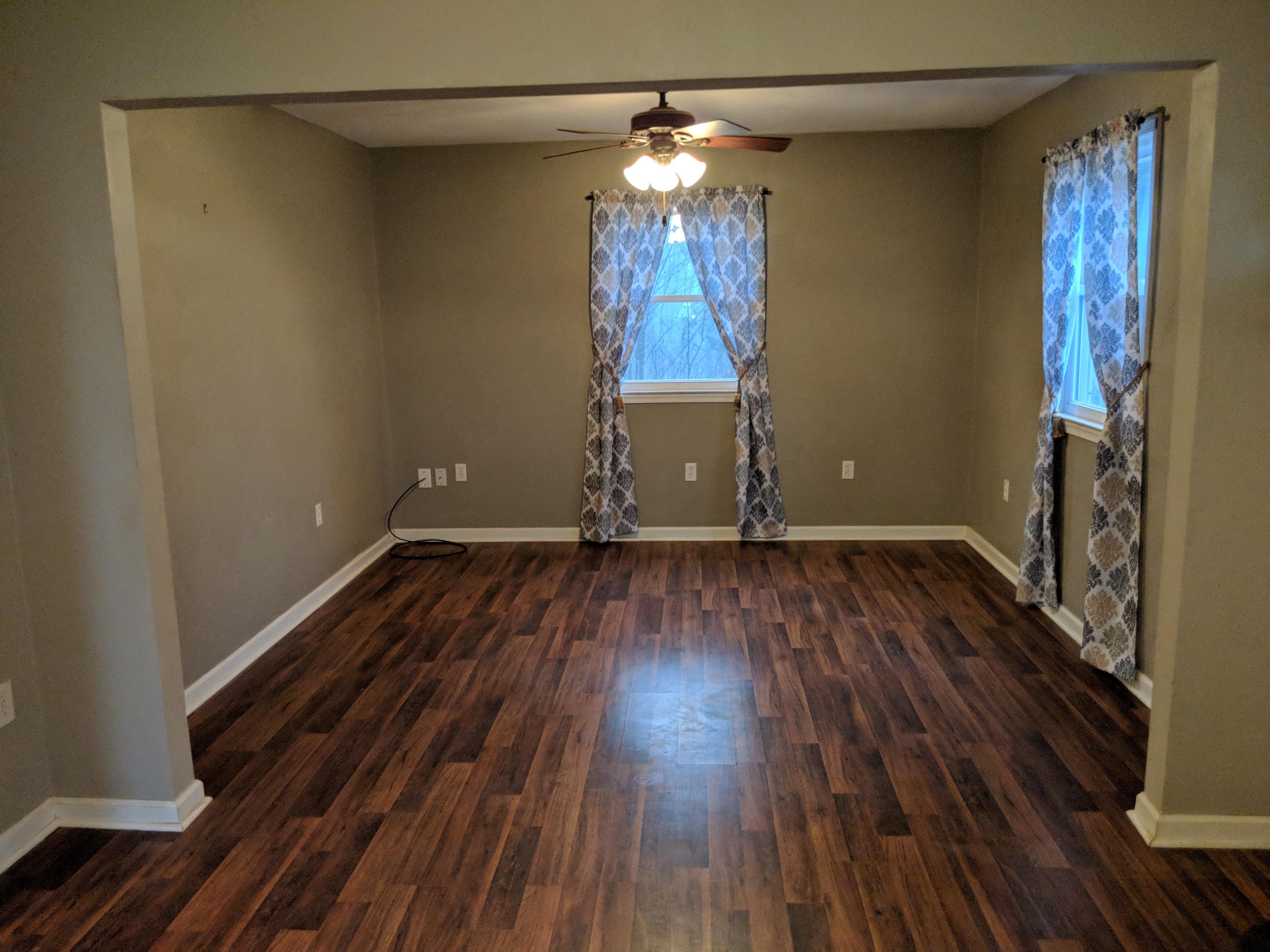 2902 Riverview Road Roanoke, VA 24014 - Photo 5 of 15 a view of a room with wooden floor and chandelier