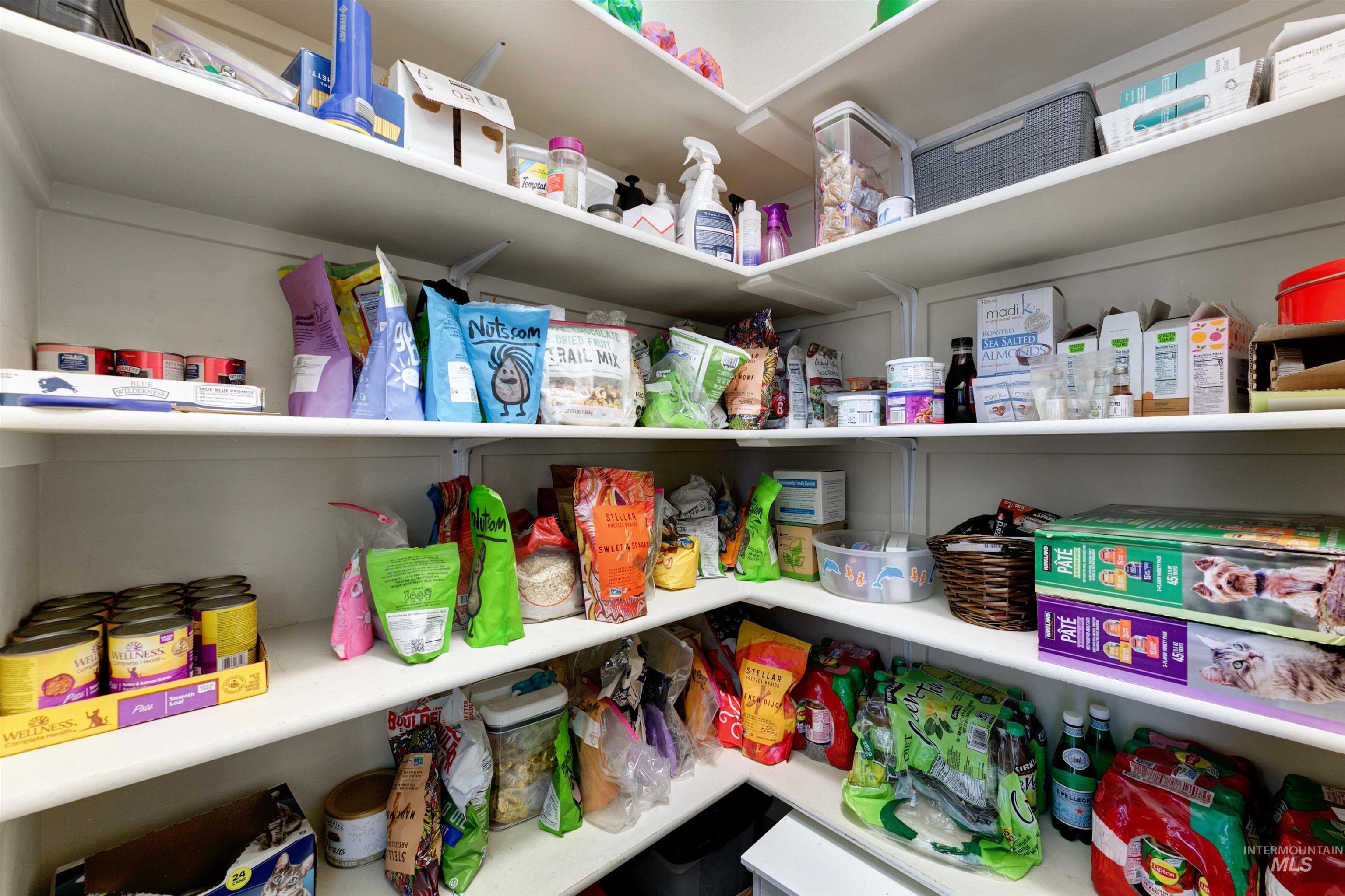 24398 Tombstone Ridge Court Middleton, ID 83644 - Photo 22 of 47 Corner pantry featuring multiple levels of white shelving