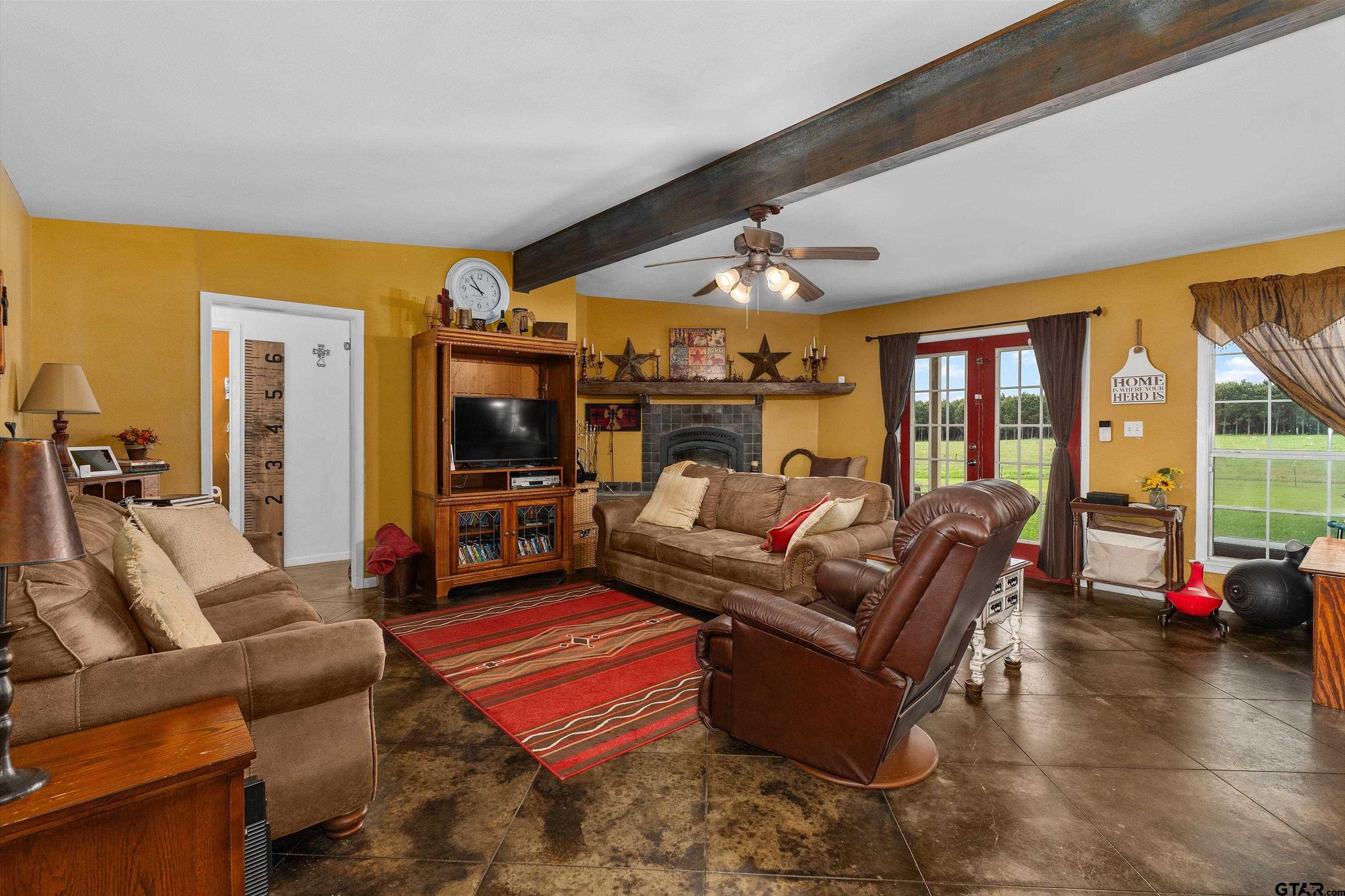8550 New Hope Road Gilmer, TX 75645 - Photo 4 of 12 a living room with furniture and a flat screen tv