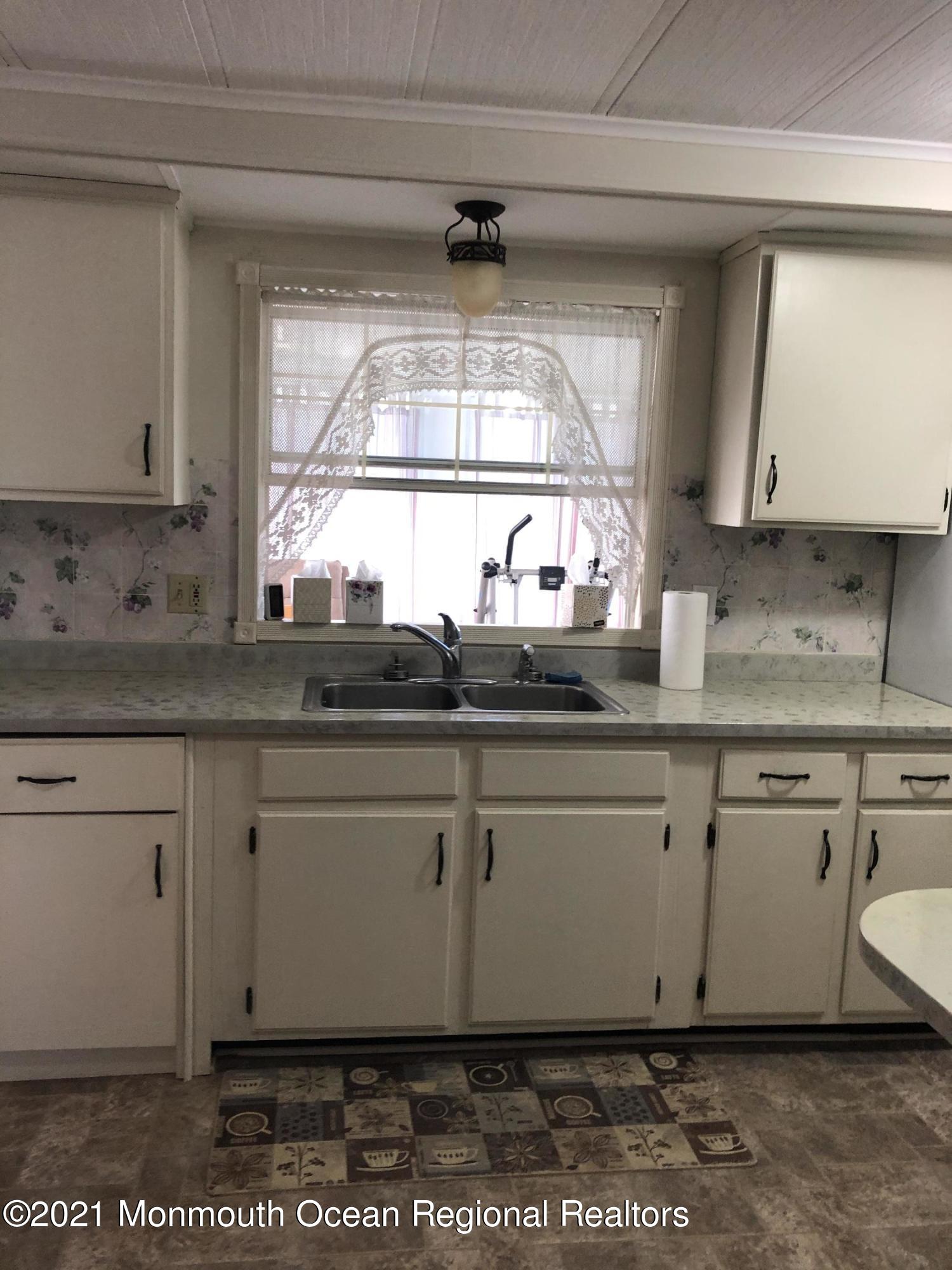 580 Cherin Road Freehold, NJ 07728 - Photo 11 of 23 a kitchen with a sink cabinets and window
