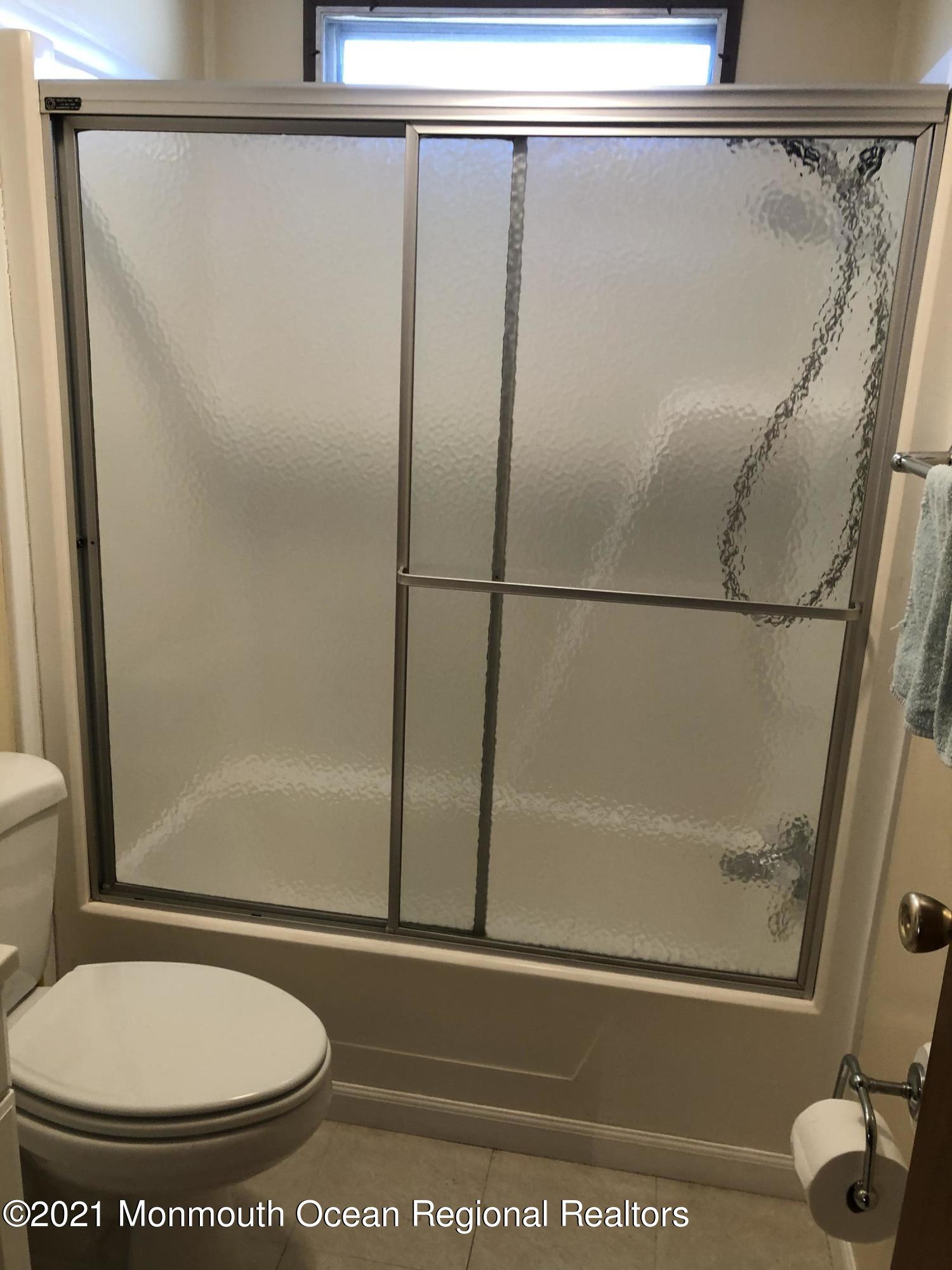 580 Cherin Road Freehold, NJ 07728 - Photo 22 of 23 a bathroom with a shower and a toilet