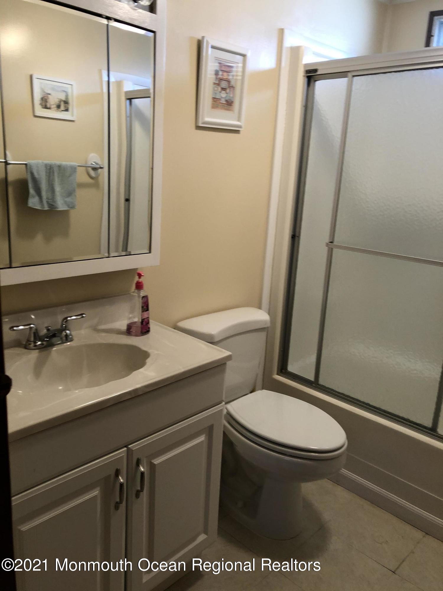 580 Cherin Road Freehold, NJ 07728 - Photo 23 of 23 a bathroom with a sink a toilet and shower