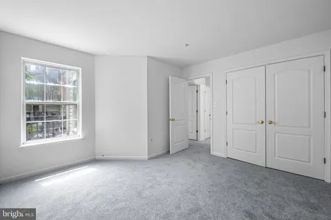 a view of empty room with windows