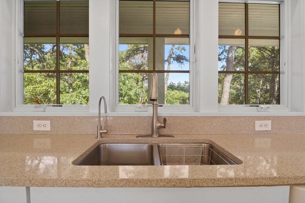6 Chickadee Lane Truro, MA 02666 - Photo 14 of 42 a kitchen with granite countertop a sink and a window