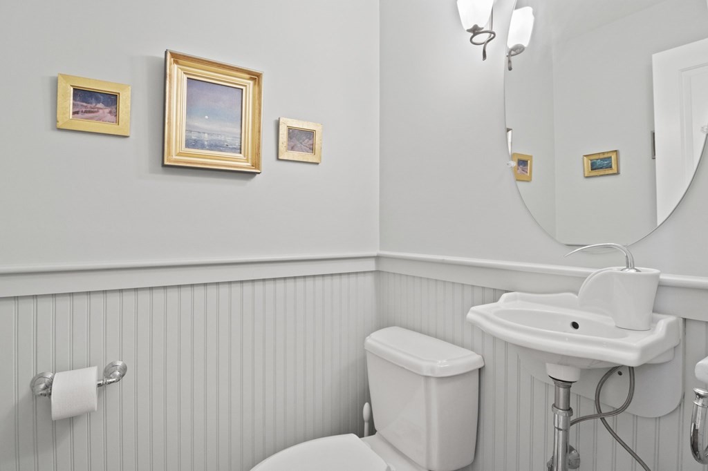 6 Chickadee Lane Truro, MA 02666 - Photo 19 of 42 a bathroom with a sink mirror and toilet
