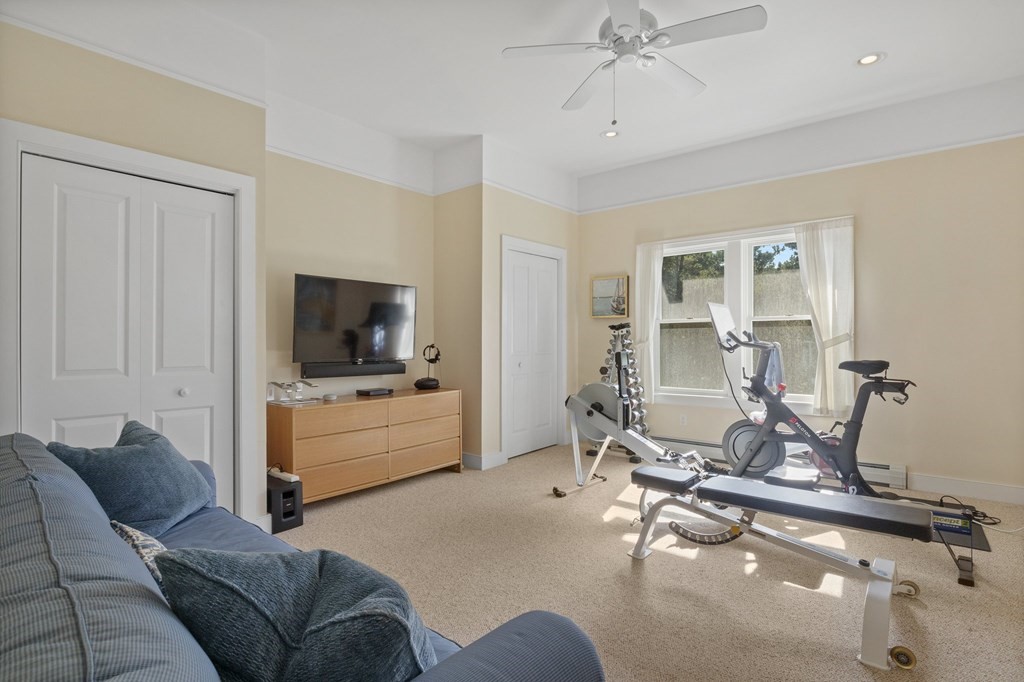 6 Chickadee Lane Truro, MA 02666 - Photo 20 of 42 a living room with furniture and a flat screen tv