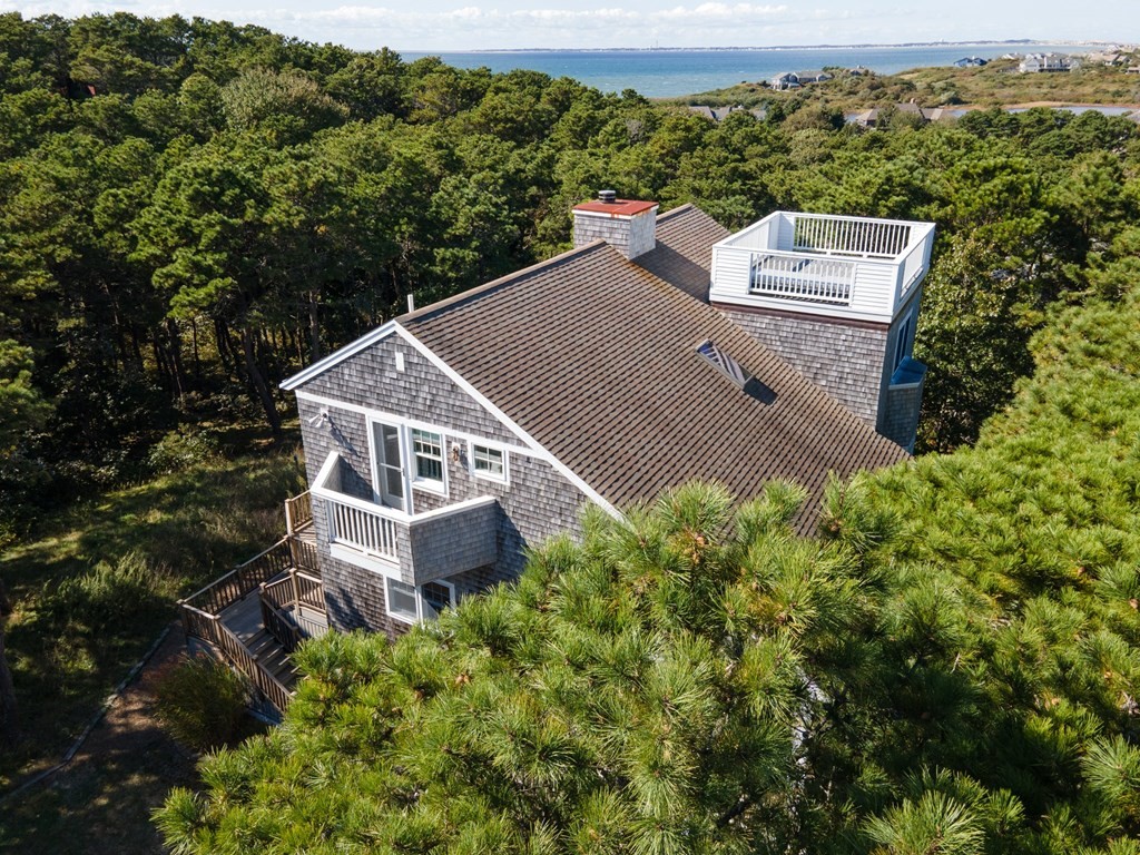 6 Chickadee Lane Truro, MA 02666 - Photo 2 of 42 an aerial view of a house with a yard