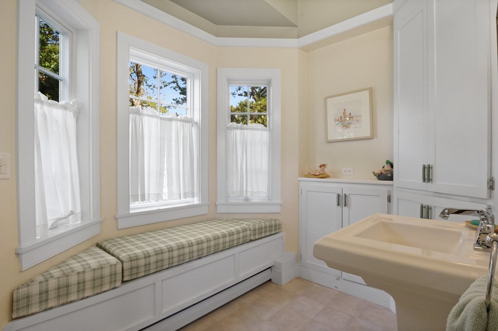 6 Chickadee Lane Truro, MA 02666 - Photo 23 of 42 a bathroom with a granite countertop sink and a mirror