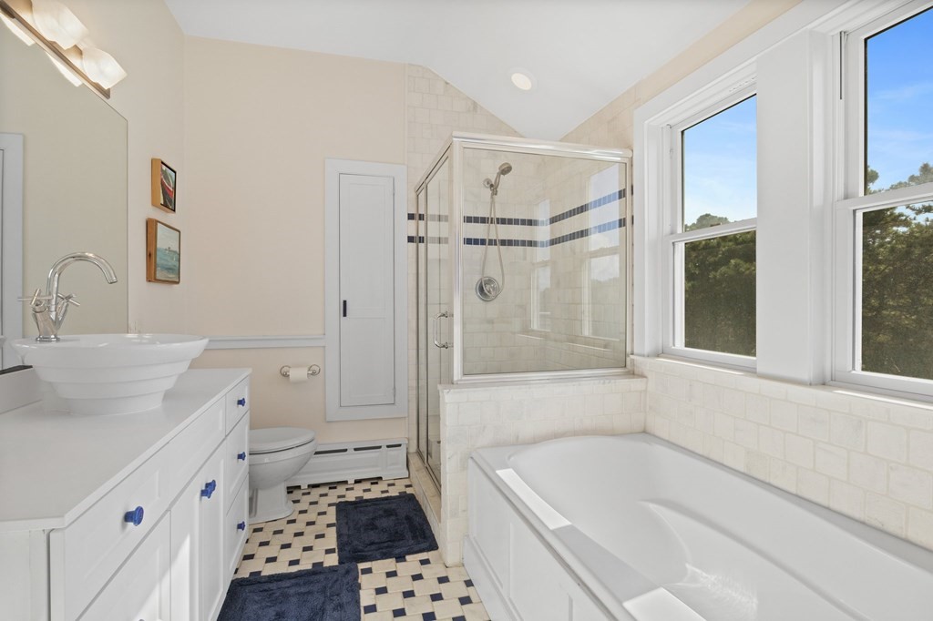 6 Chickadee Lane Truro, MA 02666 - Photo 28 of 42 a bathroom with a tub sink and a shower