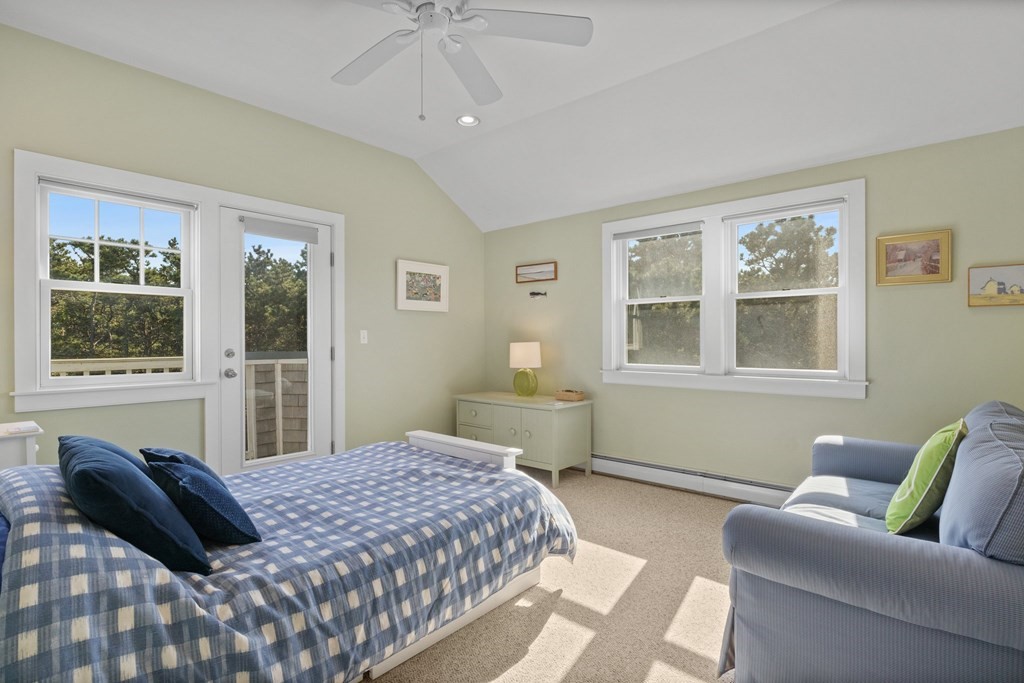 6 Chickadee Lane Truro, MA 02666 - Photo 32 of 42 a bedroom with a bed and window