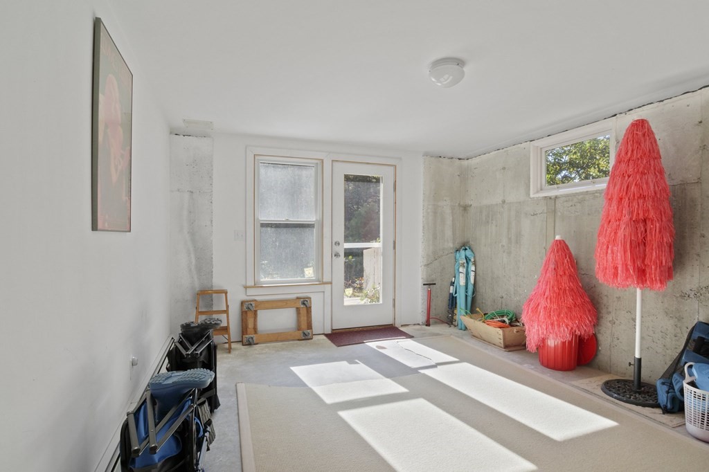 6 Chickadee Lane Truro, MA 02666 - Photo 39 of 42 a bedroom with a bed and a window