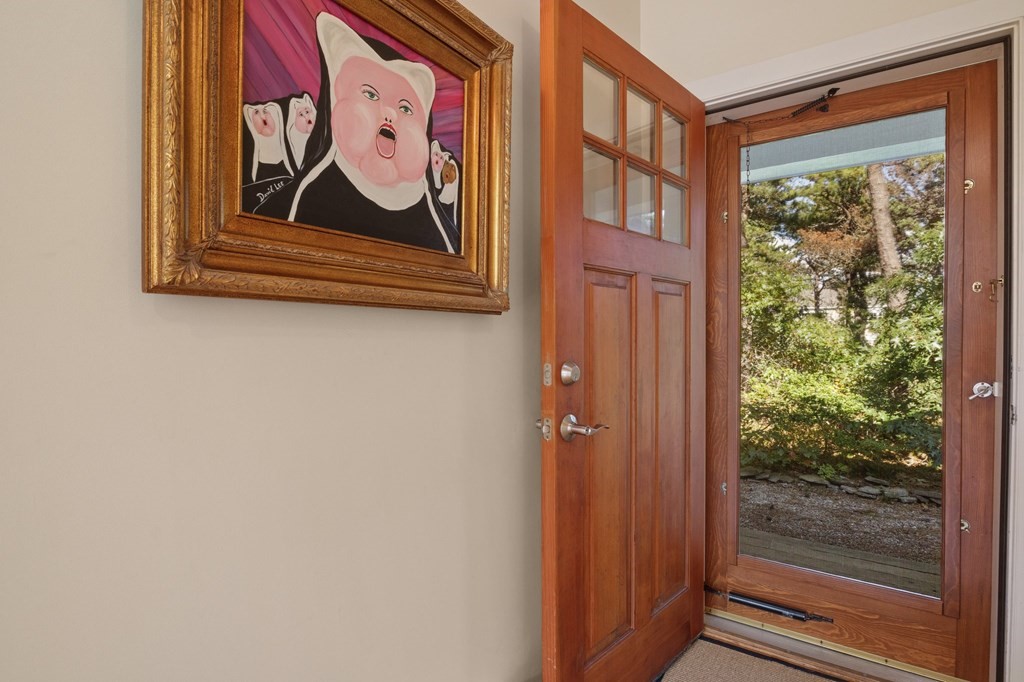 6 Chickadee Lane Truro, MA 02666 - Photo 4 of 42 a wooden door with glass door