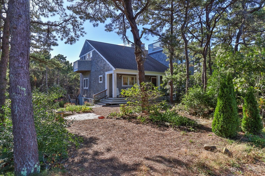 6 Chickadee Lane Truro, MA 02666 - Photo 42 of 42 a house that has a tree in front of it