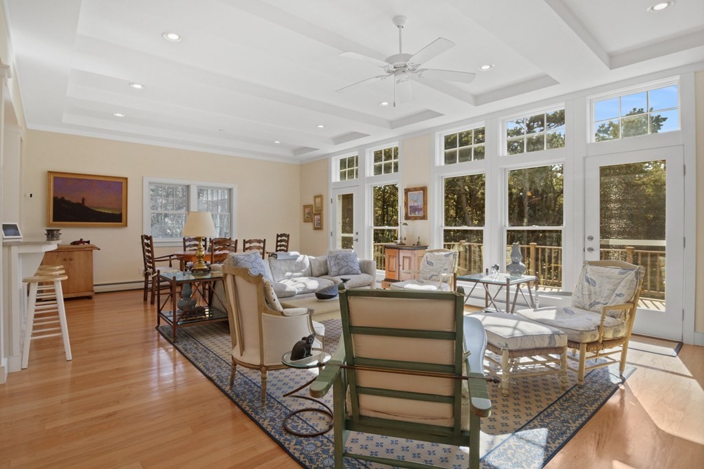 6 Chickadee Lane Truro, MA 02666 - Photo 6 of 42 a living room with furniture a flat screen tv and large window