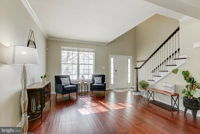 a living room with furniture fireplace and flat screen tv