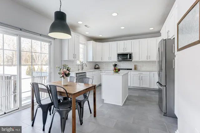 a bed room with a bed and a chandelier