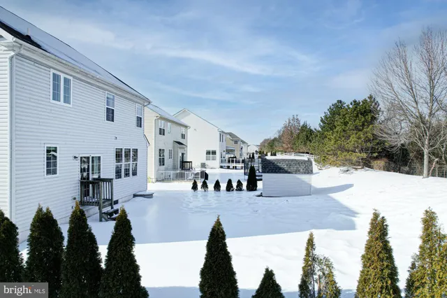 a living room with furniture window and a fireplace