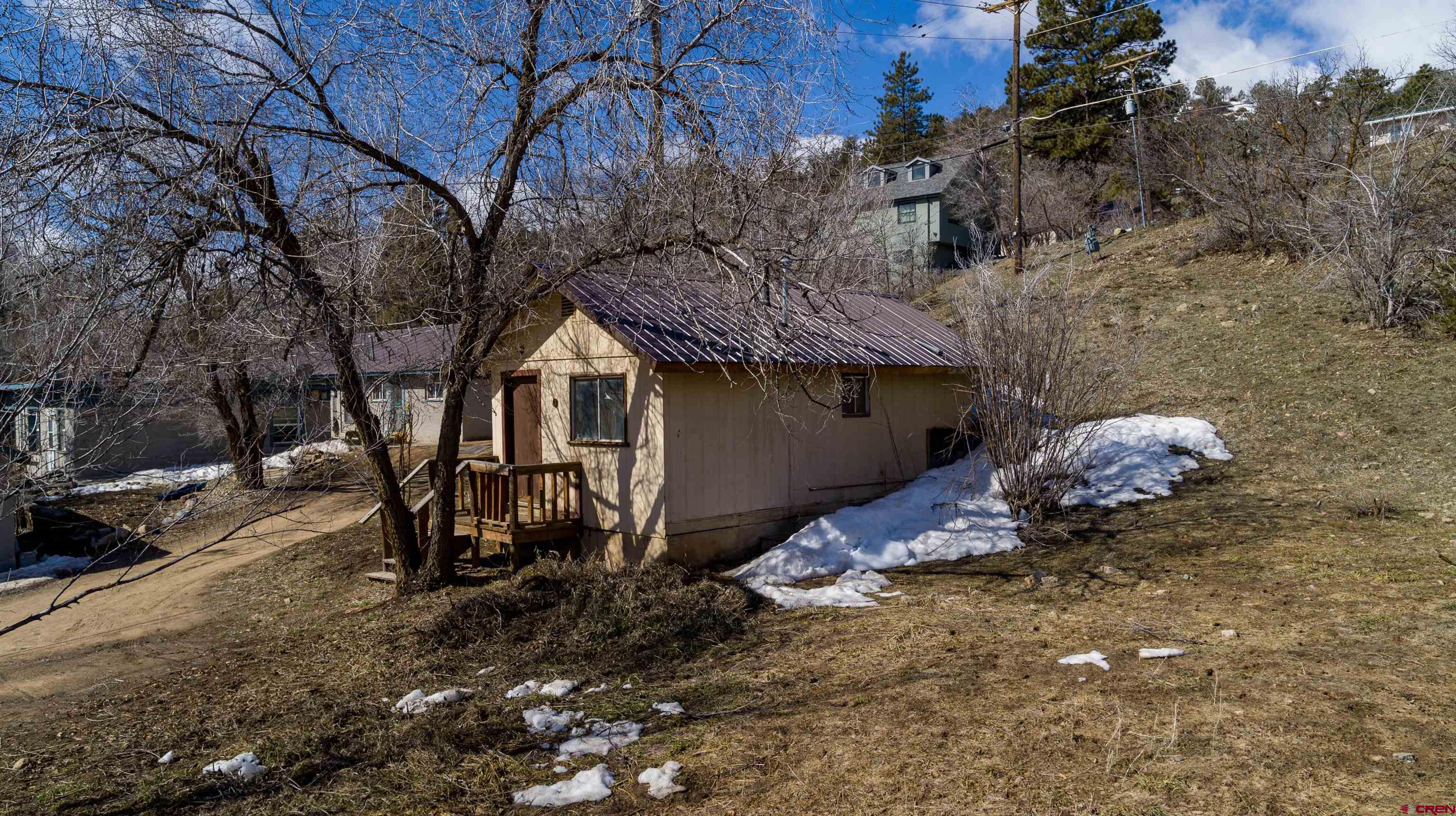 3211 West 2nd Avenue Durango, CO 81301 - Photo 19 of 22 a backyard of a house with table and chairs