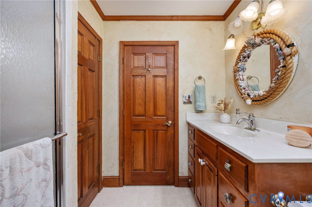 1801 Georgetown Road Heathsville, VA 22473 - Photo 72 of 83 Wood-finish vanity with an integrated sink and chr