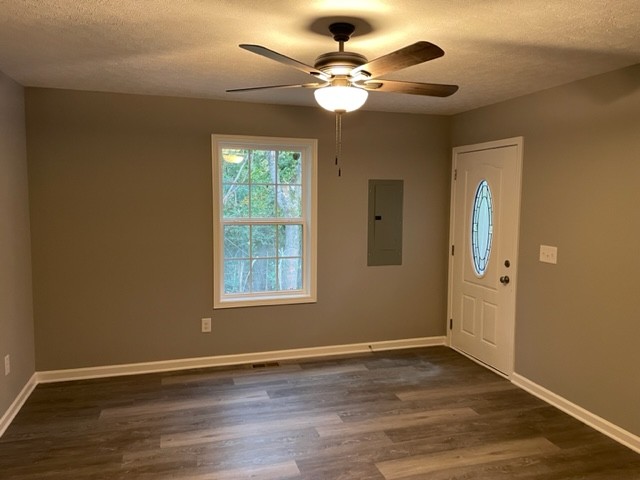 211 Sims Lane Tullahoma, TN 37388 - Photo 5 of 6 a view of an empty room with wooden floor and a window