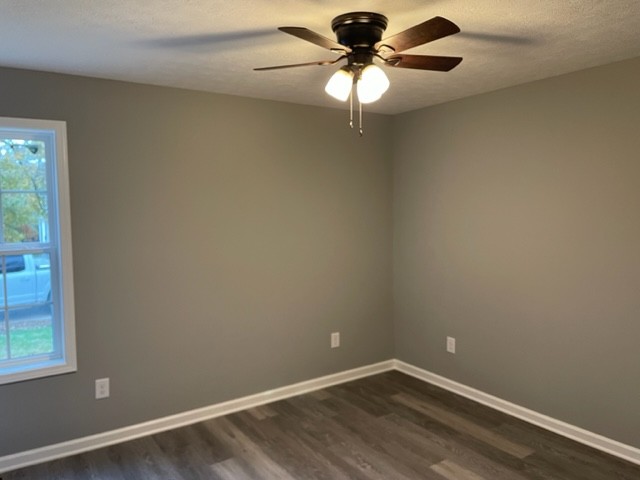211 Sims Lane Tullahoma, TN 37388 - Photo 6 of 6 an empty room with a window and a fan