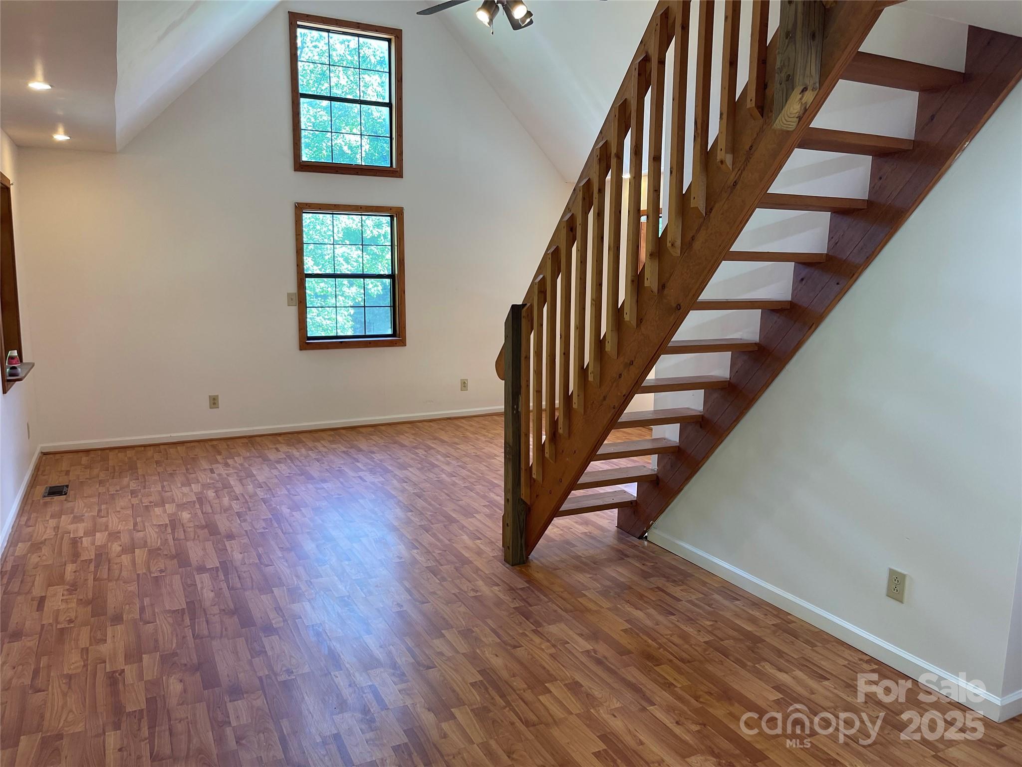 930 Copperhead Cove Road Sylva, NC 28779 - Photo 28 of 48 an entryway in a hall with wooden floor and a window