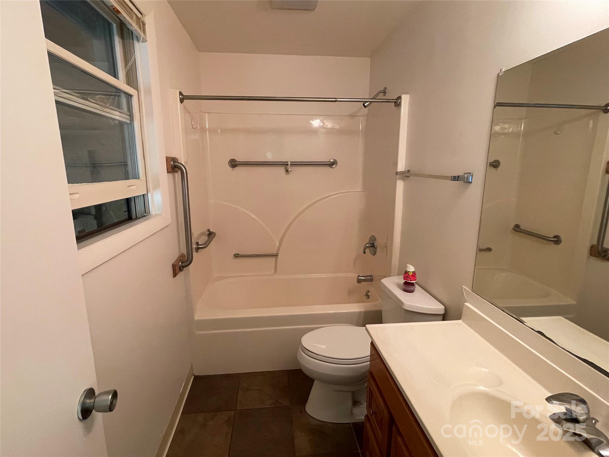 930 Copperhead Cove Road Sylva, NC 28779 - Photo 30 of 48 a bathroom with a toilet and a shower