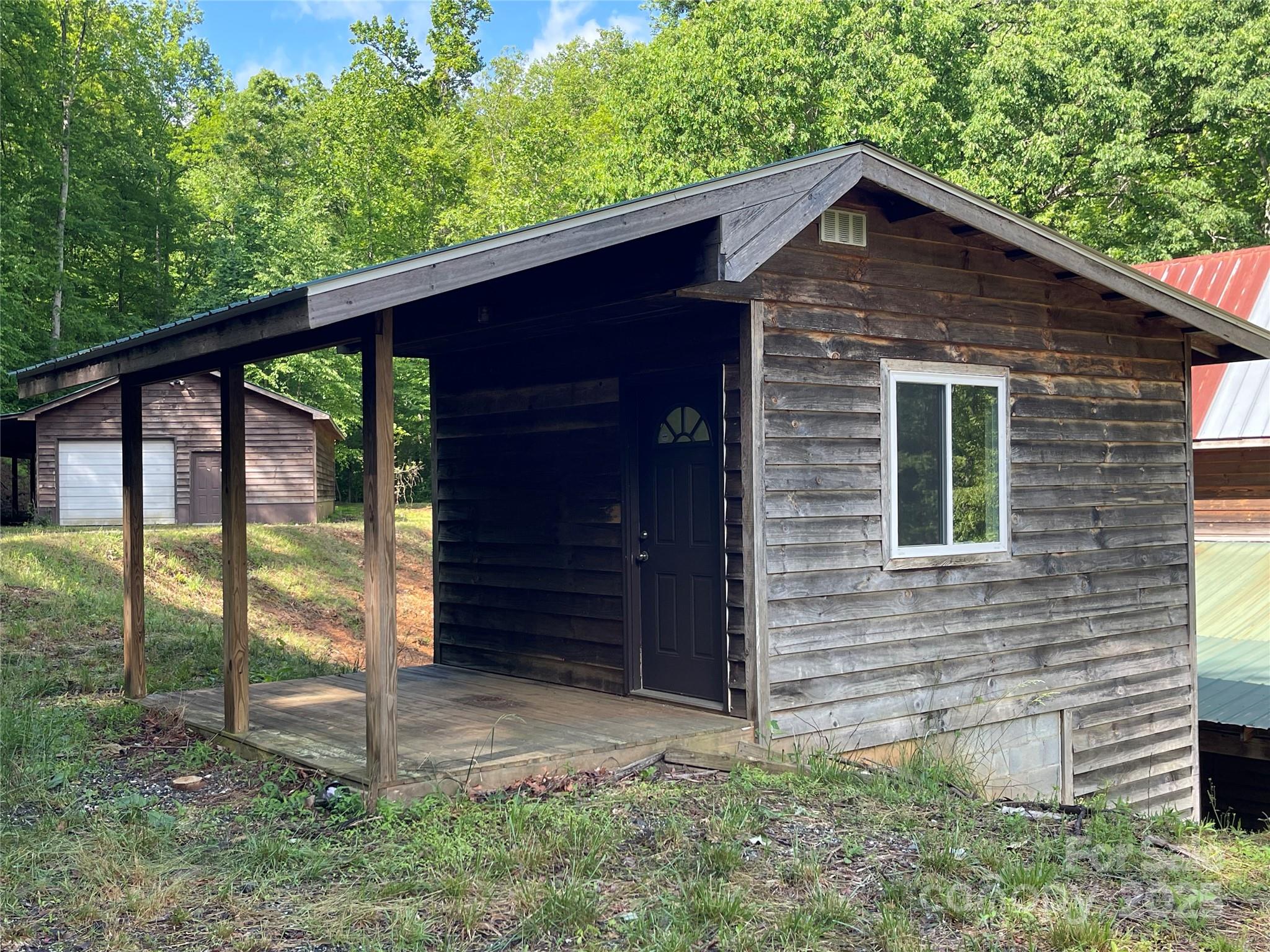 930 Copperhead Cove Road Sylva, NC 28779 - Photo 33 of 48 a front view of a house with a yard