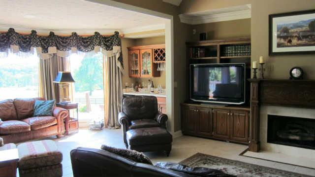 620 Cave Springs Road Lebanon, TN 37087 - Photo 8 of 20 a living room with furniture a flat screen tv and a fireplace