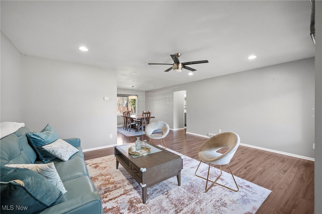 19384 Howe Road Strongsville, OH 44136 - Photo 8 of 40 Living room featuring recessed lighting, wood finished floors, baseboards, and ceiling fan