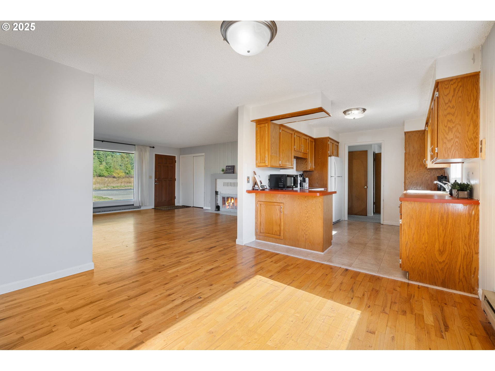 122 Armstrong Road Chehalis, WA 98532 - Photo 11 of 40 a view of a kitchen with furniture and wooden floor