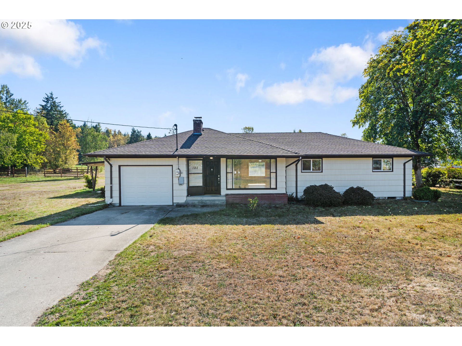 122 Armstrong Road Chehalis, WA 98532 - Photo 2 of 40 a front view of a house with a yard and garage
